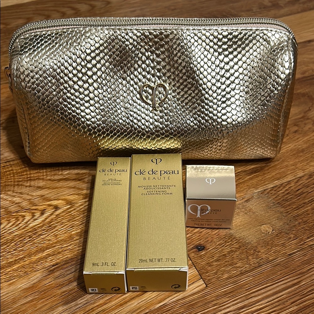 Clé de Peau Beauté Gold Cosmetic Bag with Skincare Products